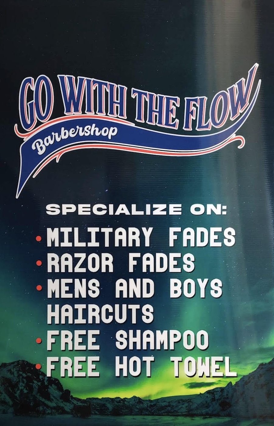 Go With The Flow Barbershop sign: military fades, razor fades, men's and boys' haircuts, free shampoo, free hot towel